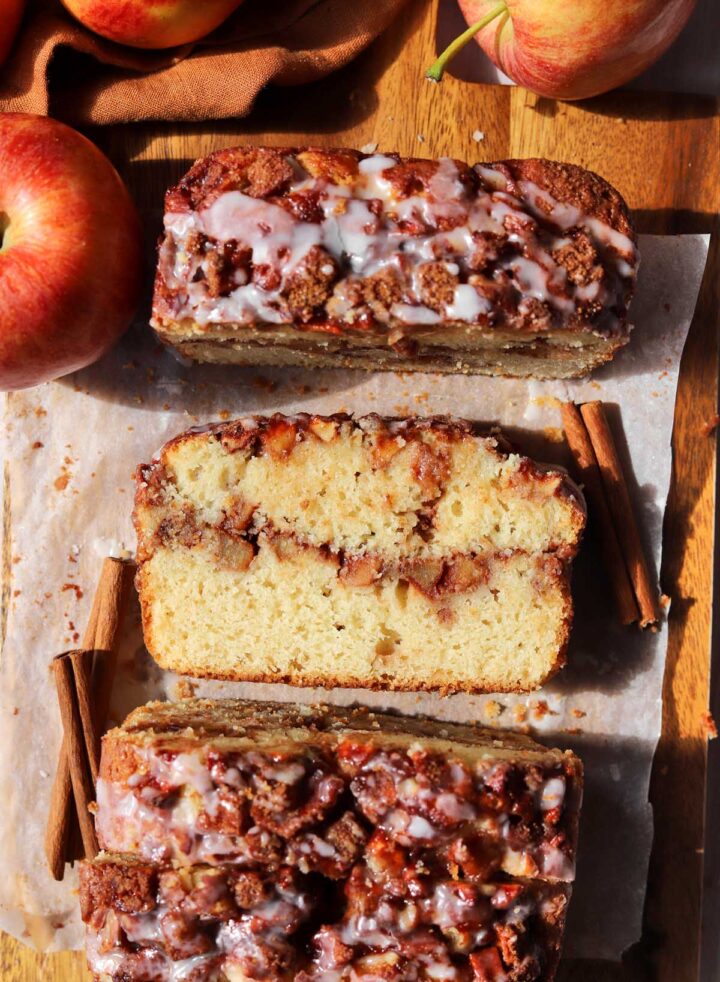 top view of cinnamon apple fritter bread with slice showing cross section