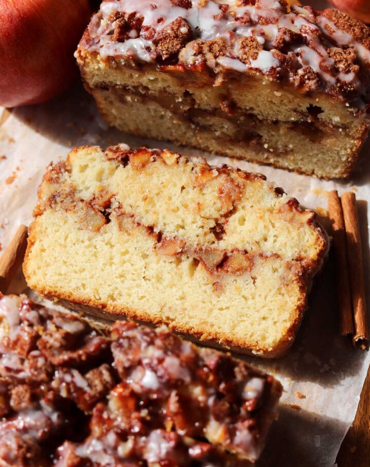 top view of cinnamon apple fritter bread with slice showing cross section
