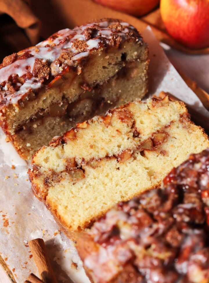 top view of cinnamon apple fritter bread with slice showing cross section