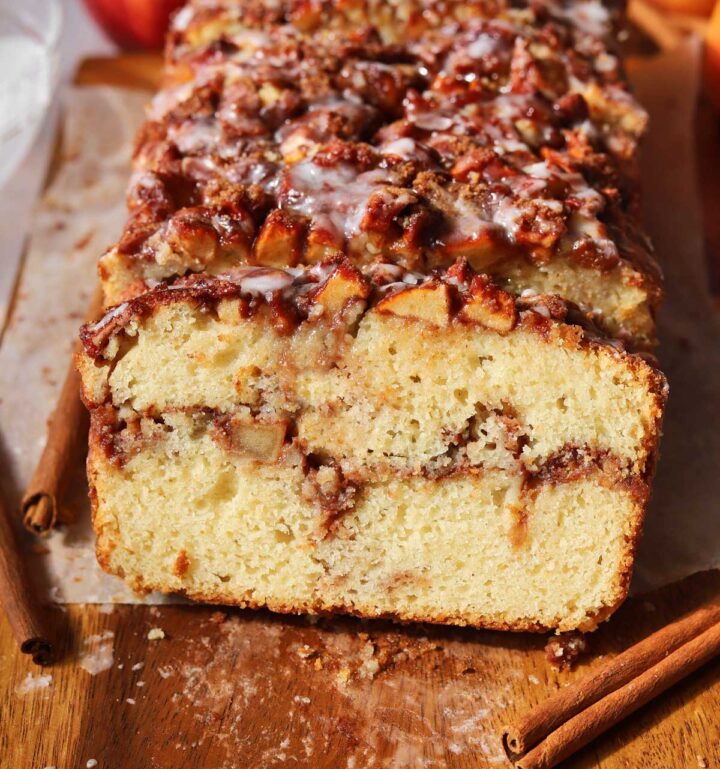 sliced cinnamon apple fritter bread with slice showing cross section