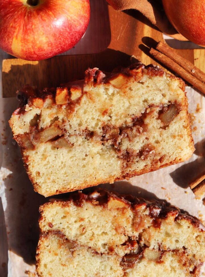top view of cinnamon apple fritter bread with slice showing cross section