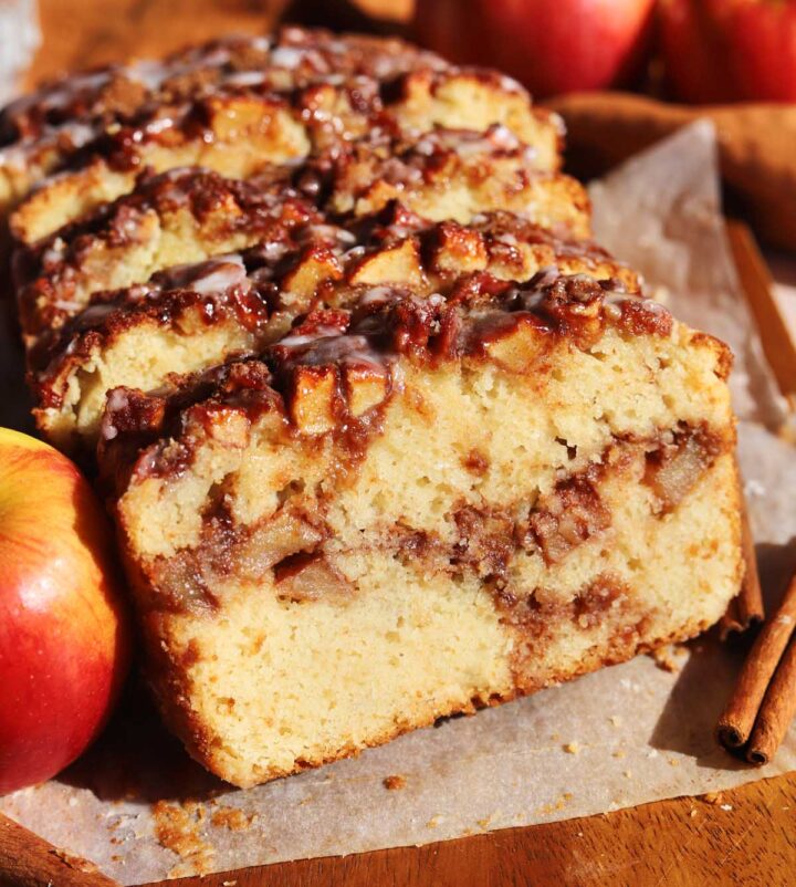 sliced cinnamon apple fritter bread with slice showing cross section