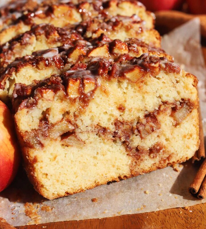 sliced cinnamon apple fritter bread with slice showing cross section