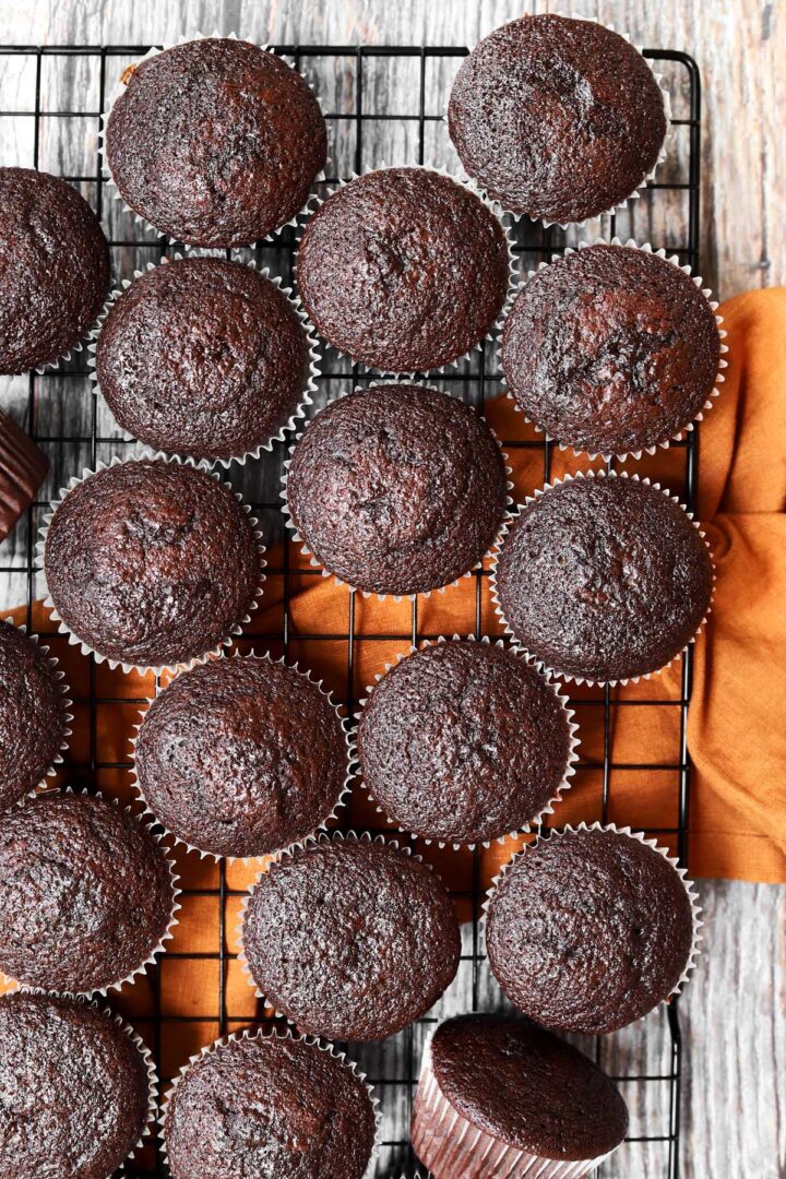 top view of the best moist chocolate cupcakes cooling on a wire rack