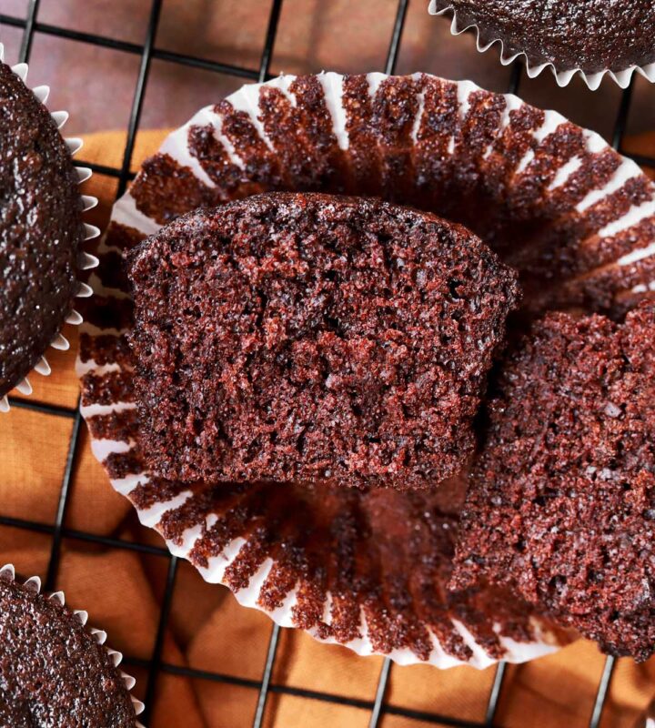 best moist chocolate cupcake cut in half showing tender moist crumb texture