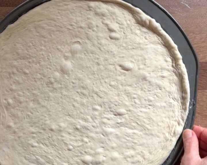 Set the pan aside and let the dough rise again until puffy.