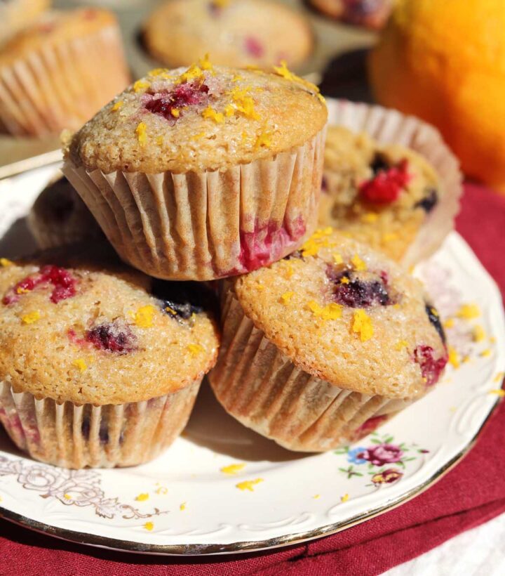 healthy olive oil Greek yogurt berry muffins stacked on a plate