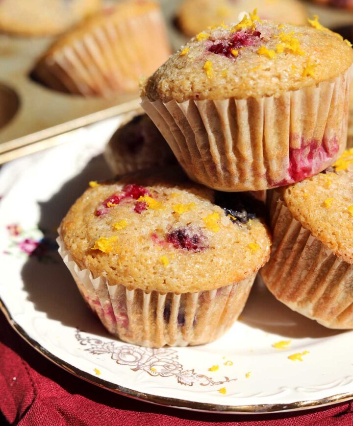 healthy olive oil Greek yogurt berry muffins stacked on a plate