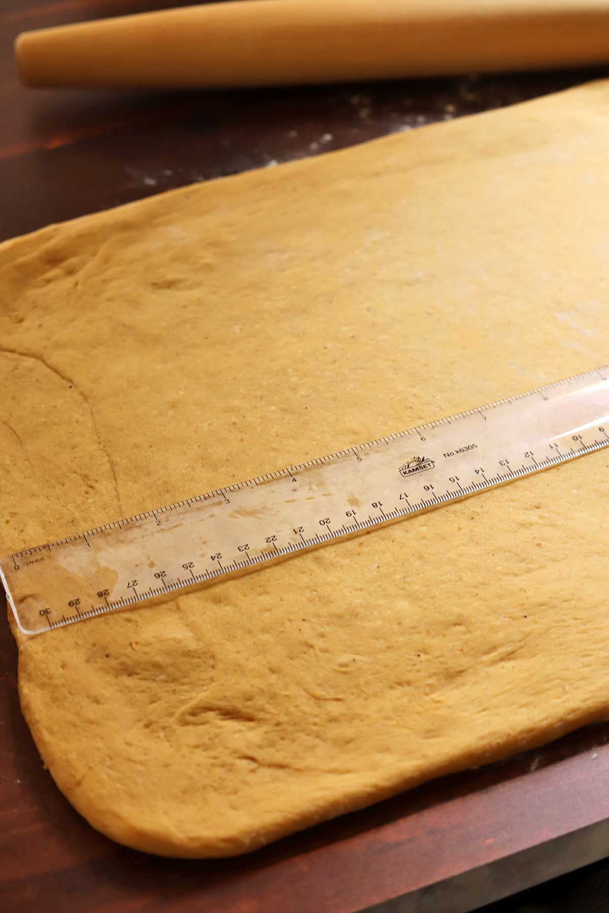 pumpkin cinnamon roll dough rolled out