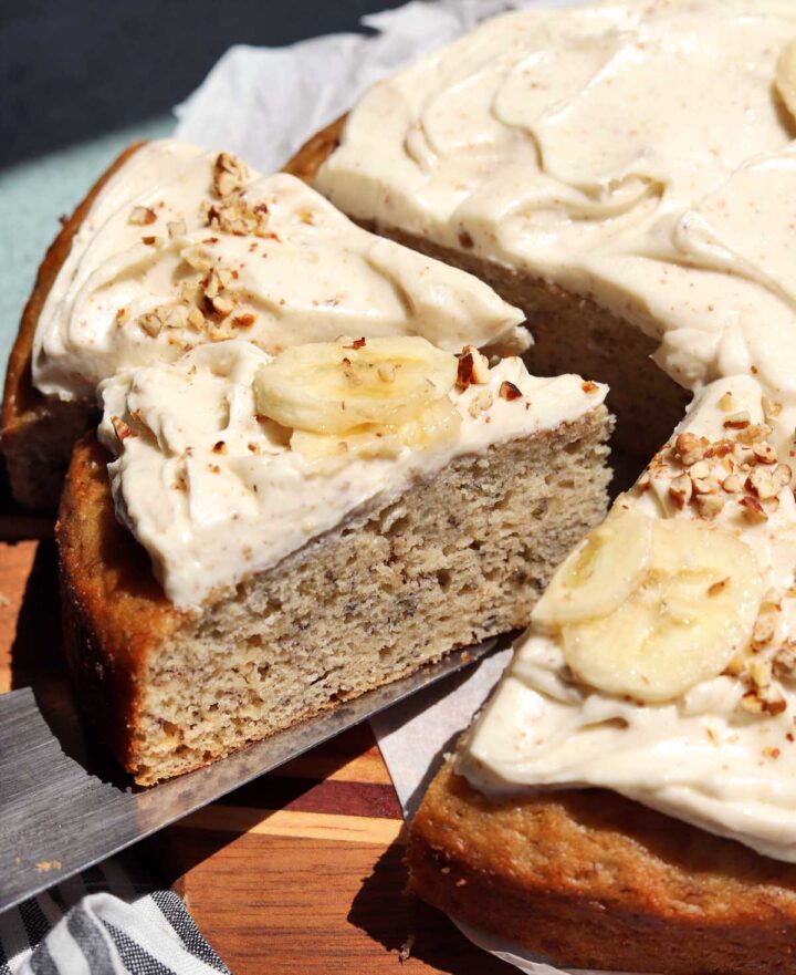brown butter banana cake sliced on cutting board