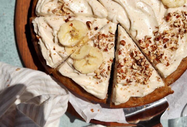 top view of brown butter banana cake sliced on cutting board