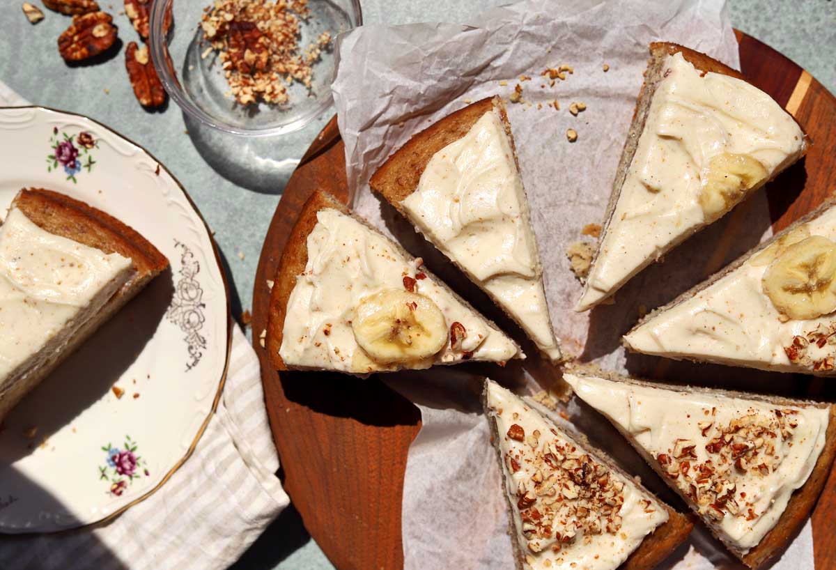 top view of sliced brown butter banana cake on cutting board