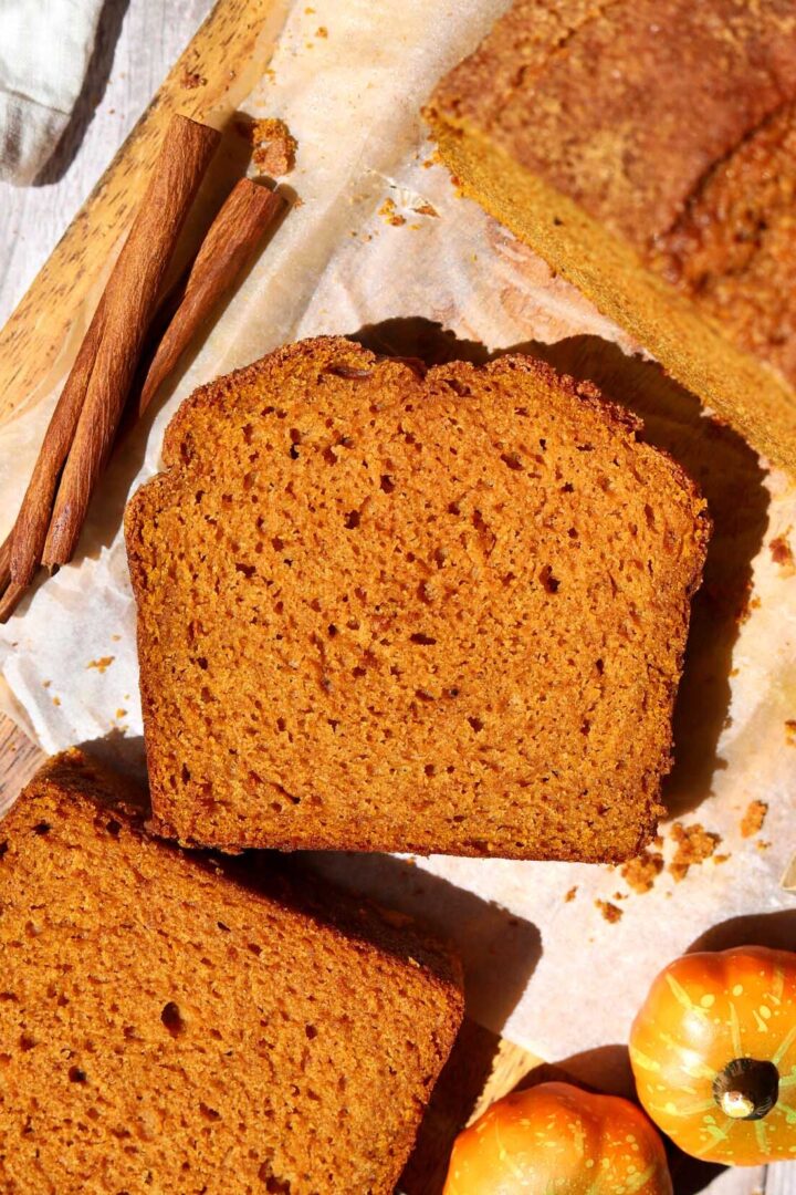 top view of the best pumpkin bread slice on cutting board