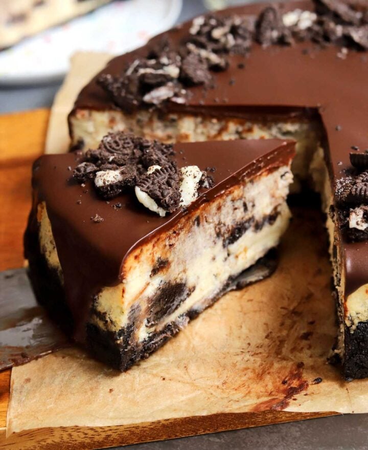 Oreo cookies & cream cheesecake before with slice cut out