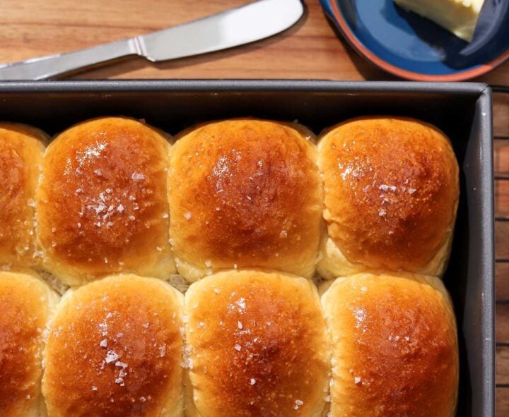 top view of soft homemade dinner rolls in baking pan