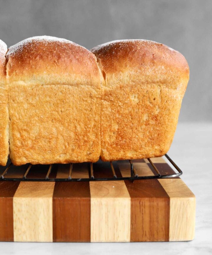 homemade sandwich bread after baking, cooling on wire rack