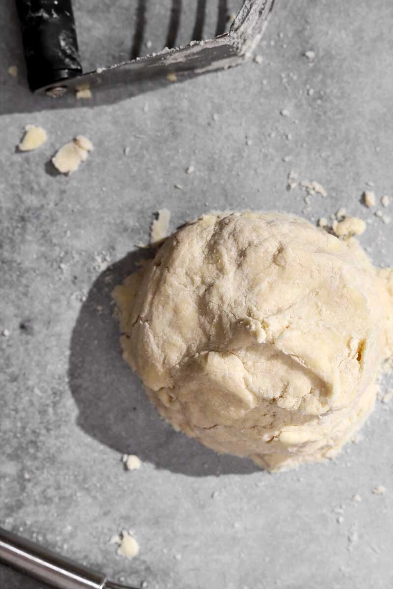 Dough holds shape when pressed and squeezed into a ball.