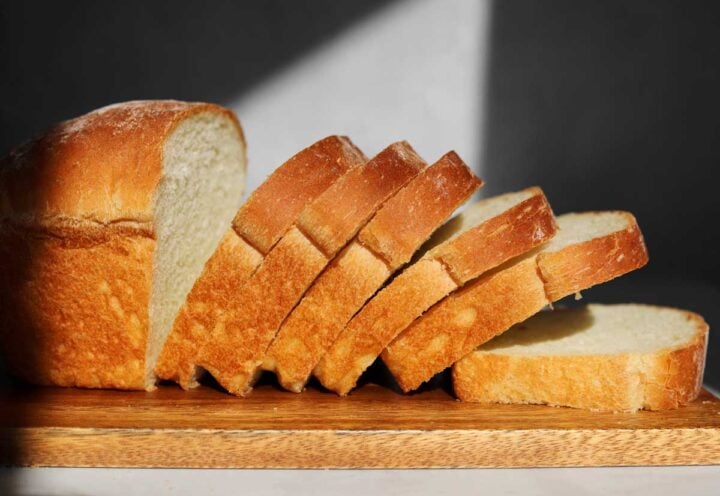 homemade sandwich bread sliced on cutting board