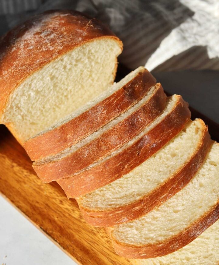 homemade sandwich bread sliced on cutting board