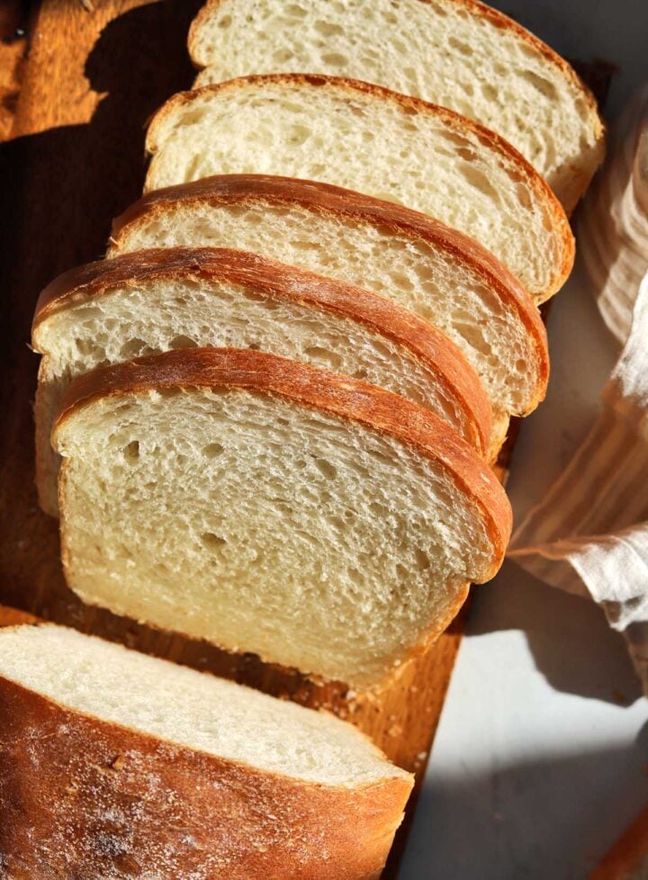 homemade sandwich bread sliced on cutting board