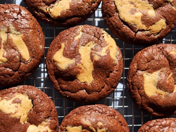chocolate peanut butter fudge swirl cookies on cooling rack