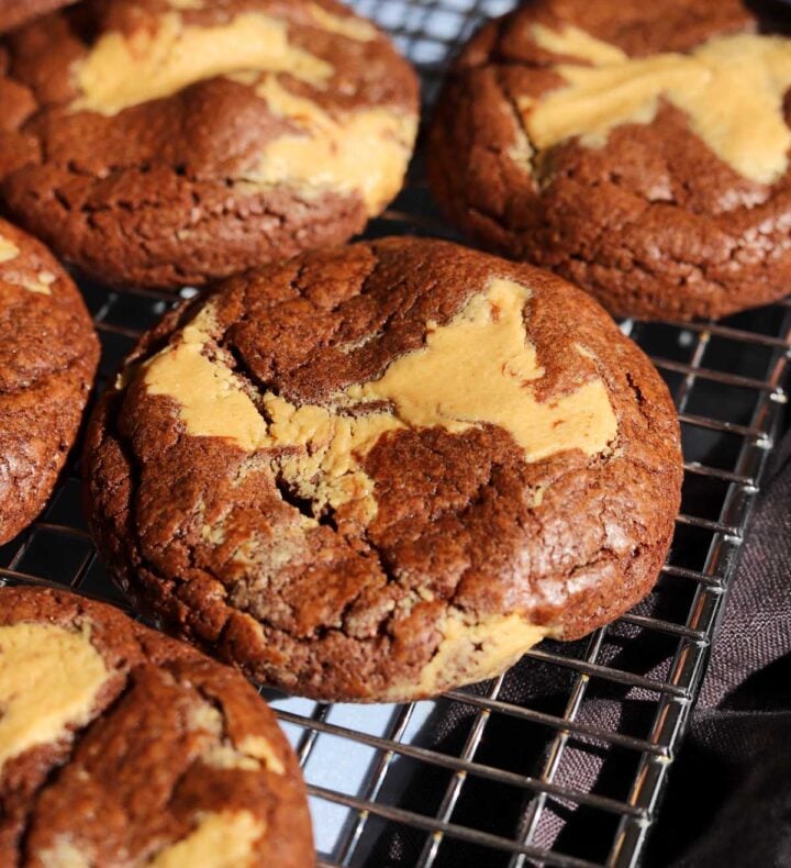 chocolate peanut butter fudge swirl cookies on cooling rack