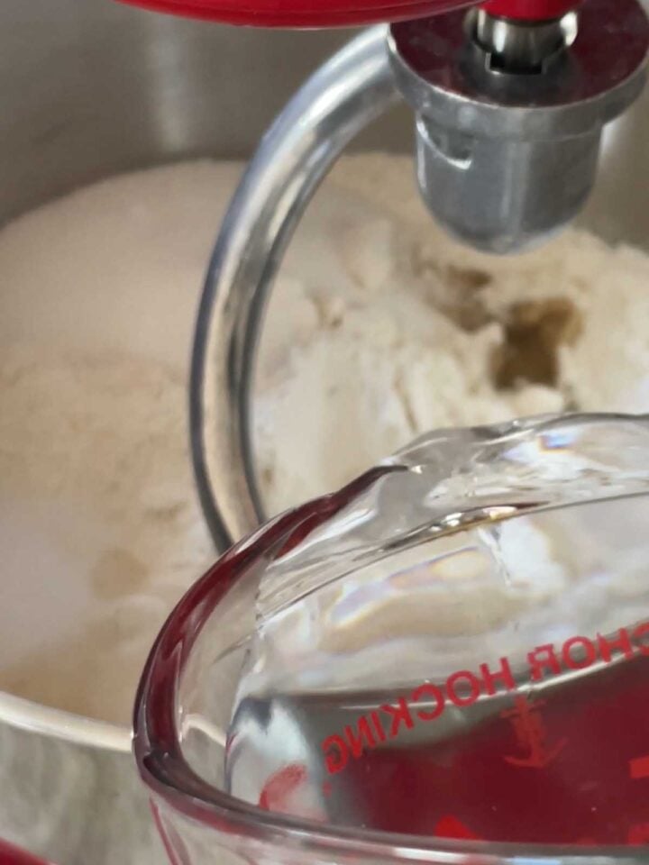 Add water to mixer bowl while mixing.