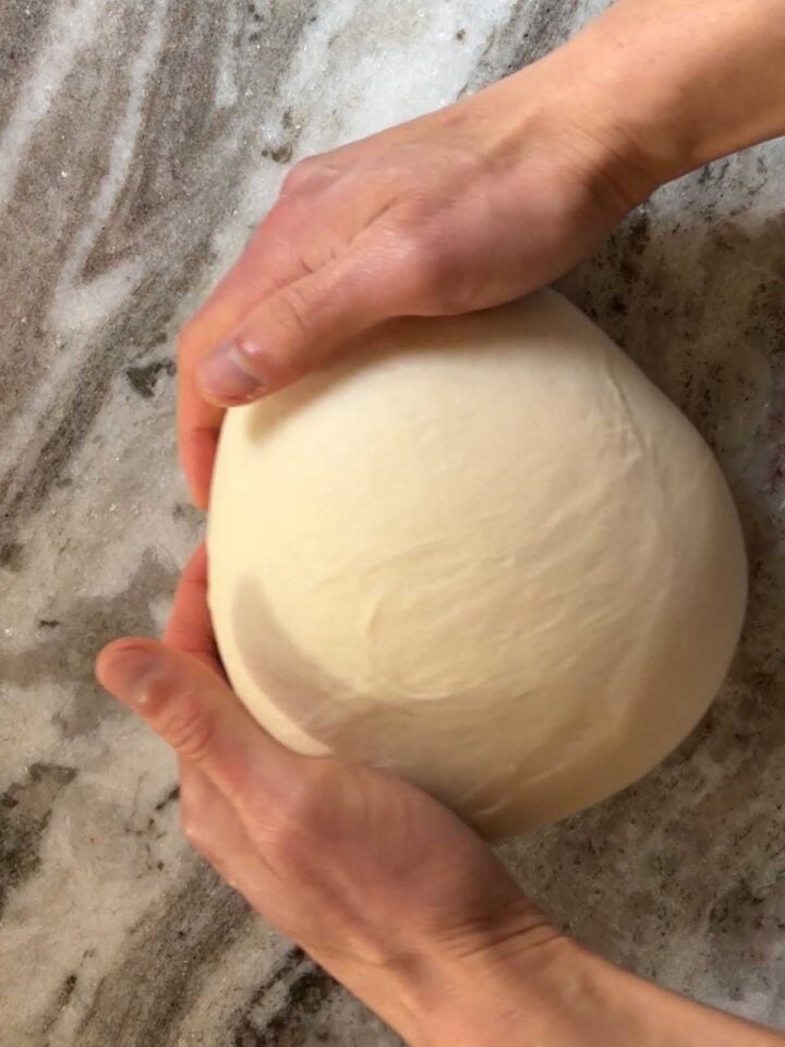 Shape the dough into a ball and set aside to rise in a covered bowl.