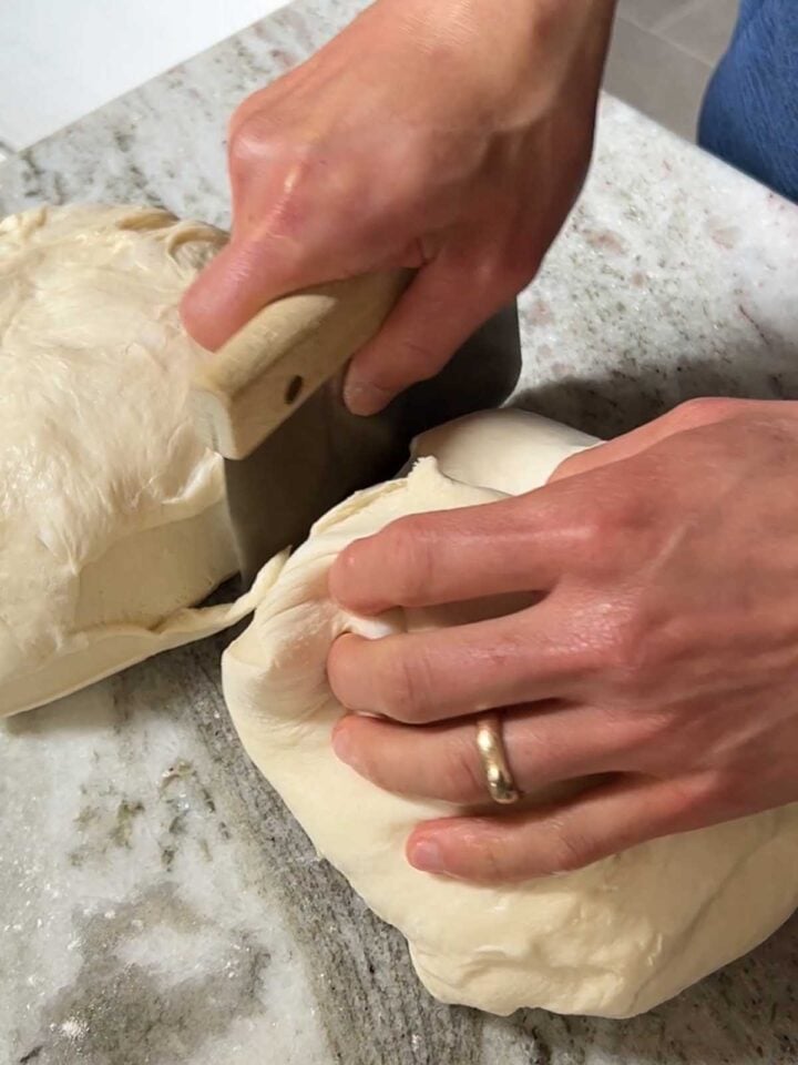 Divide the dough in half to make two loaves.