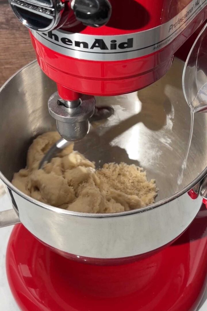 Begin mixing on low, adding more water gradually as needed.